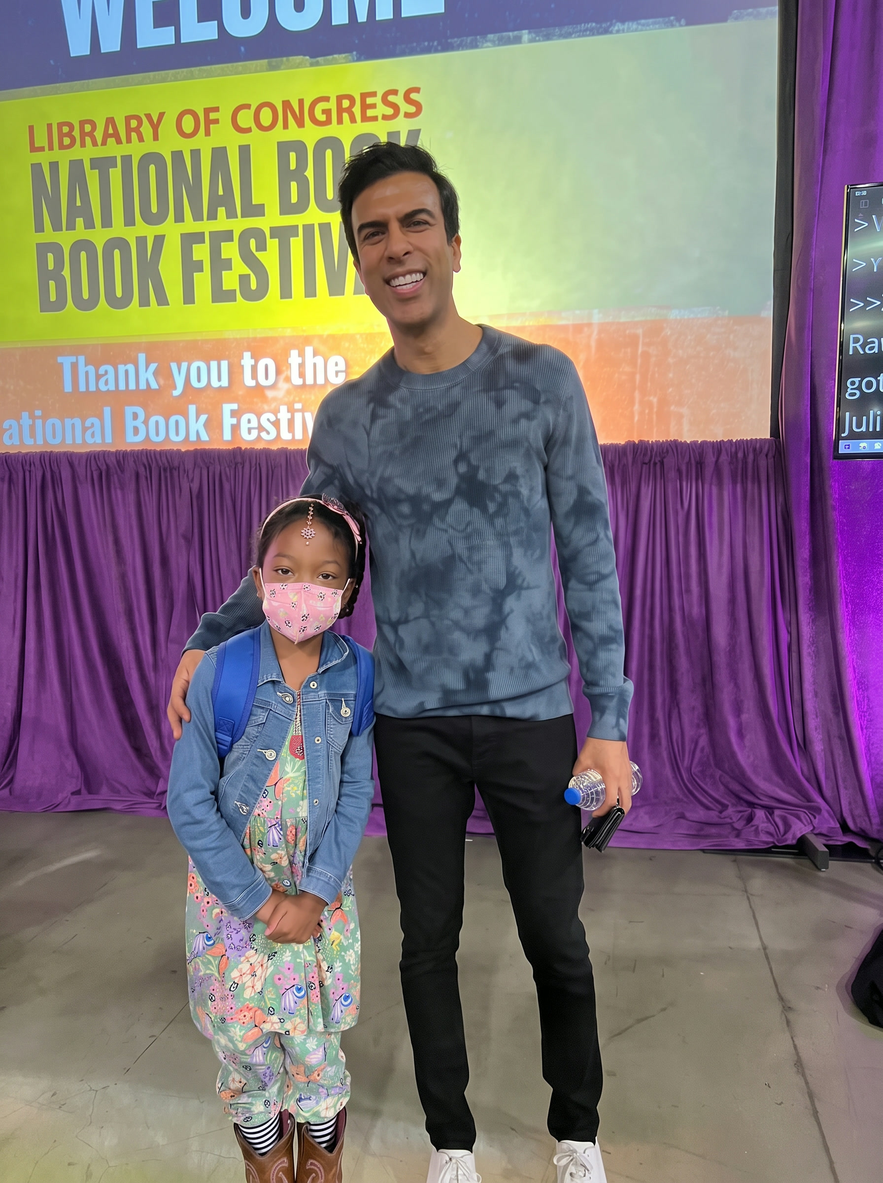 Ishara standing with Soman Chainani, author of School for Good and Evil