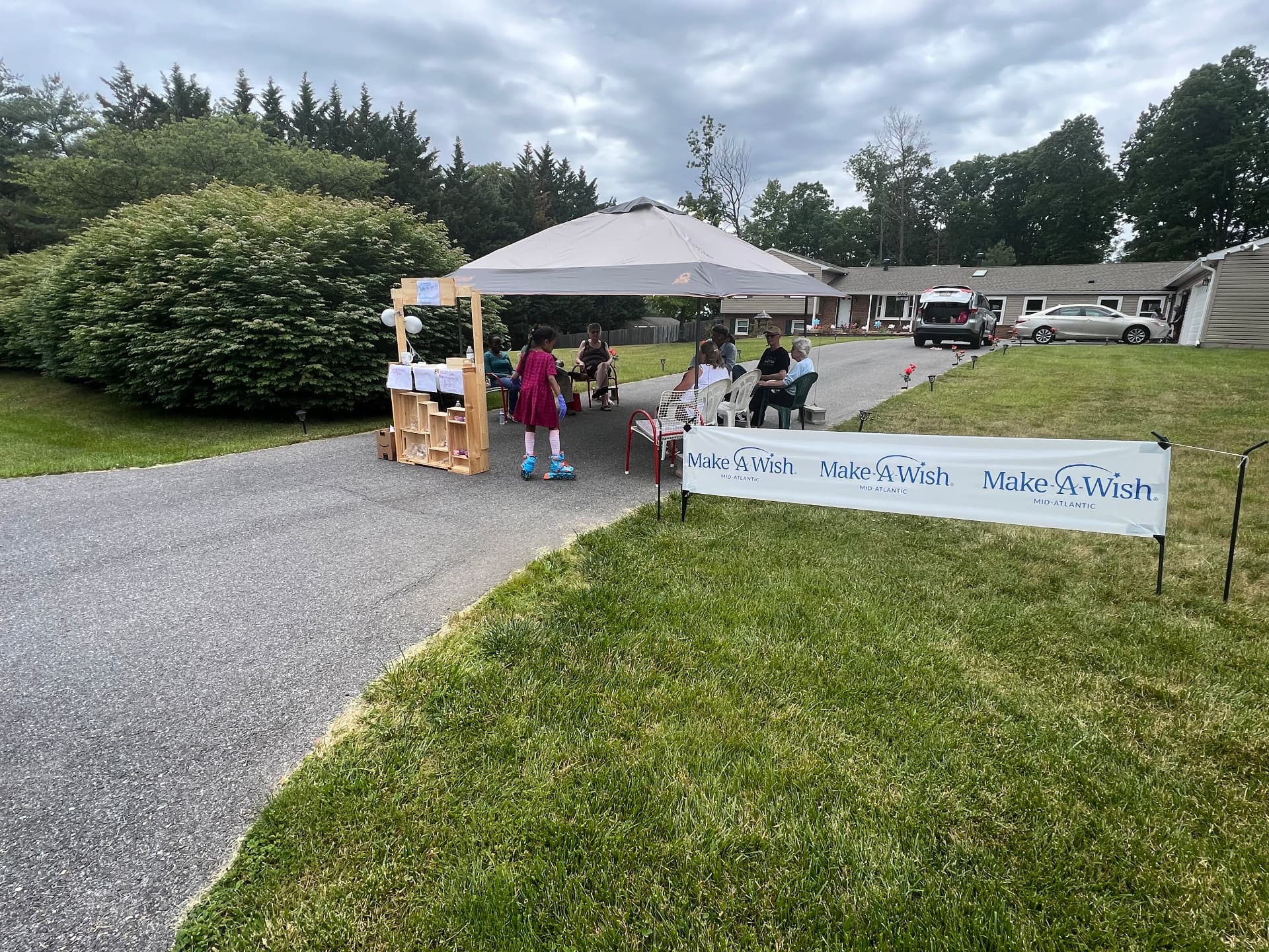 The Make-A-Wish Mid-Atlantic banner at the end of Ishara's driveway bake sale