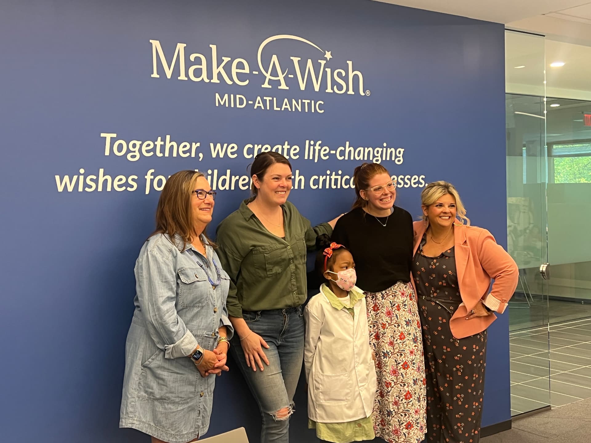 Ishara with the Make-A-Wish Mid-Atlantic director and regional executive director