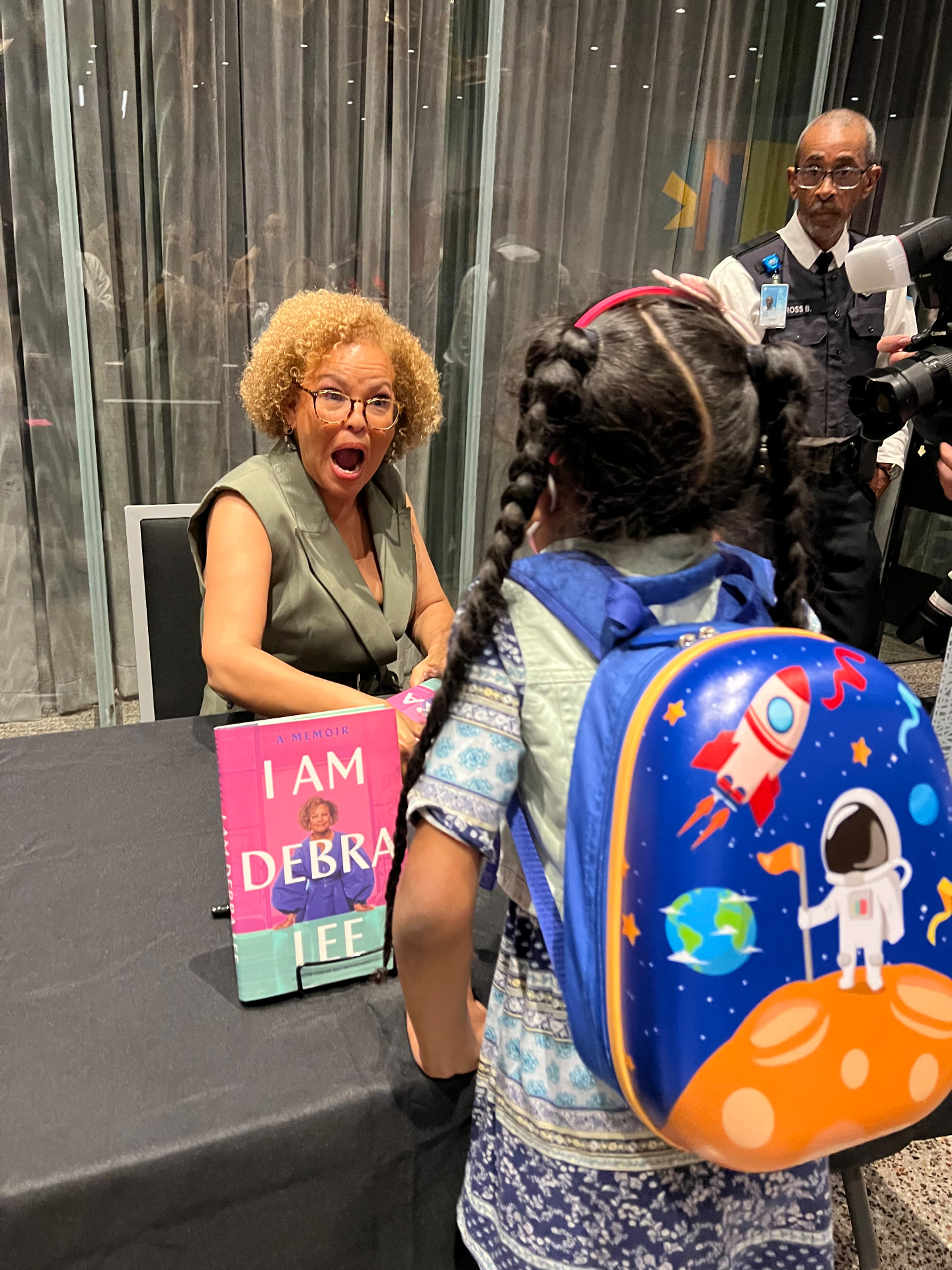 Ishara speaking with Debra Lee at the book signing