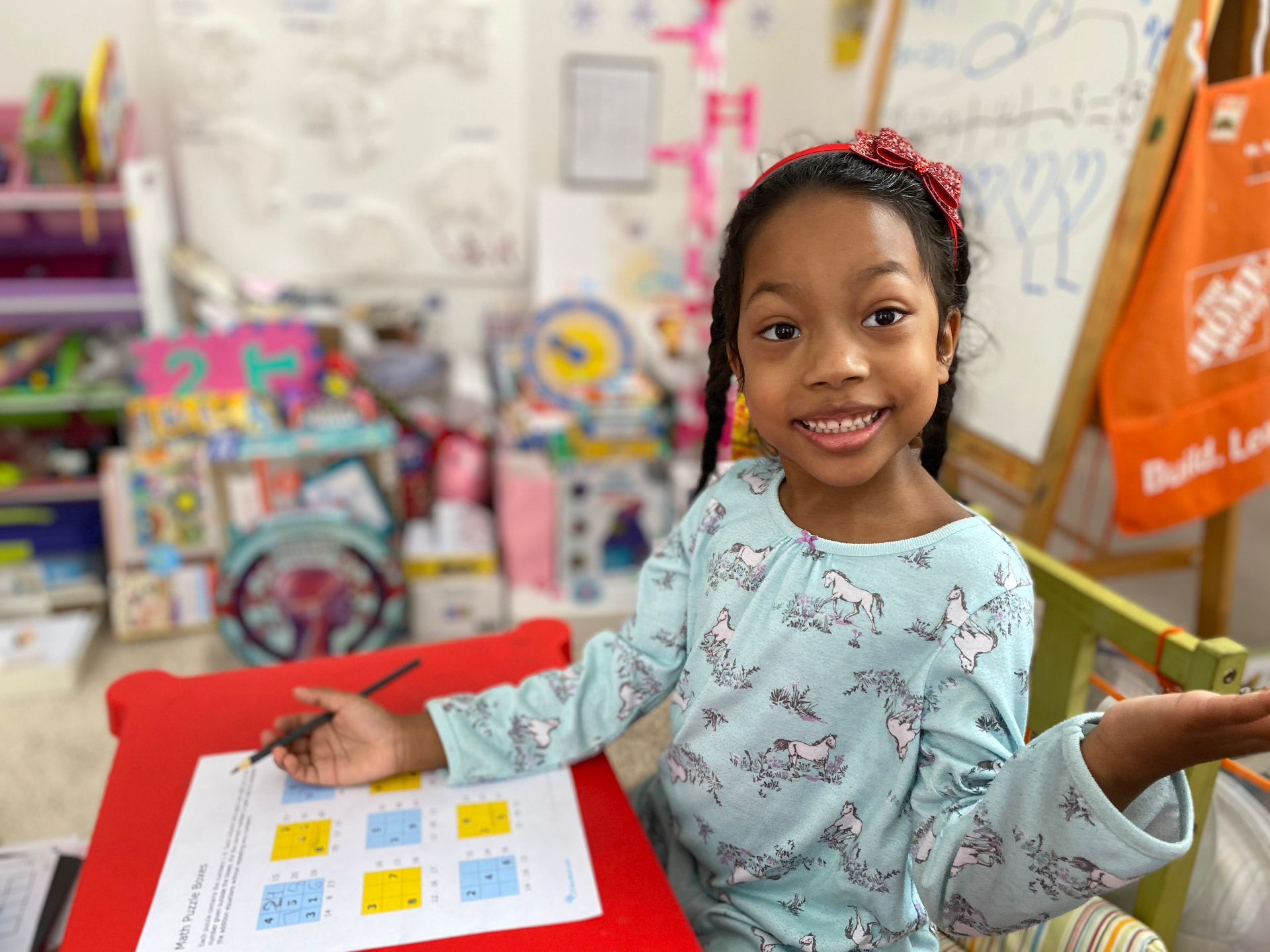 Ishara smiling while solving math puzzles