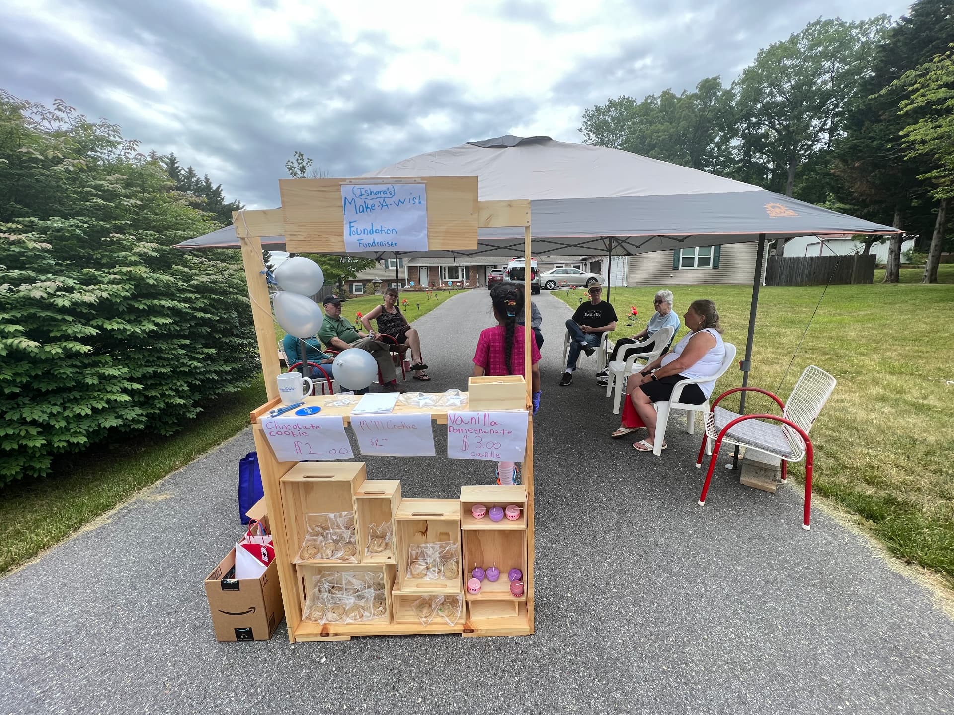 Ishara's Make-A-Wish Foundation Fundraiser cookie shop with guests seated nearby