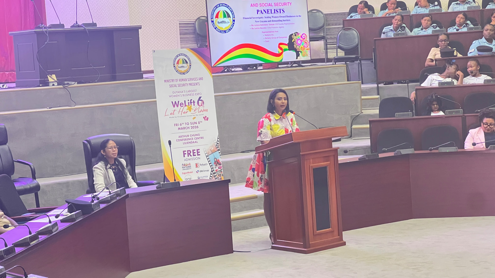 A speaker at the podium during the WeLift 6 conference in Guyana