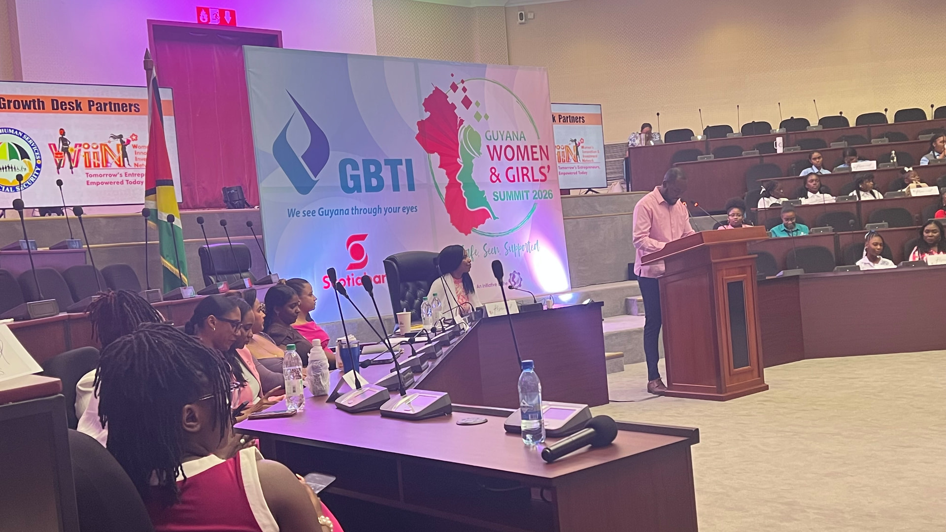 The Guyana Women and Girls' Summit 2026 stage with speakers and panelists